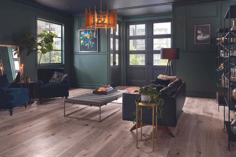 light white oak in moody drama living room with vintage chandelier